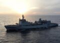 A side-view photograph of the Indian Navy’s indigenously built Survey Vessel (Large) (SVL) INS Ikshak (J23). The ship is seen sailing at sea.