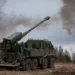 Modern self-propelled howitzer firing in an open field, representing firepower in the war of attrition