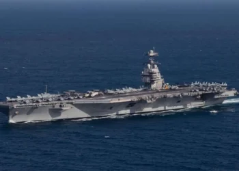 The aircraft carrier USS Gerald R. Ford (CVN-78) underway in the Atlantic Ocean, being deployed to the Middle East.