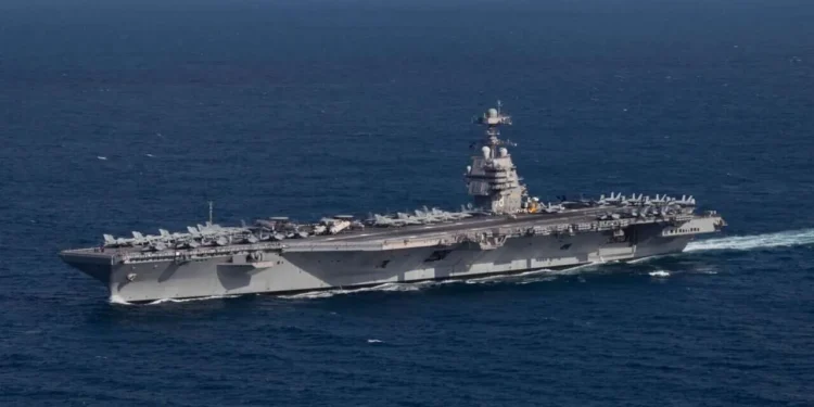 The aircraft carrier USS Gerald R. Ford (CVN-78) underway in the Atlantic Ocean, being deployed to the Middle East.