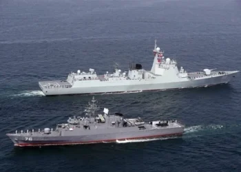Warships from Iran, Russia, and China sailing together during the Maritime Security Belt 2026 naval exercise in the Strait of Hormuz.