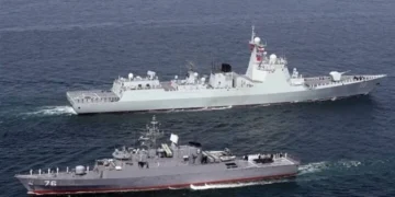 Warships from Iran, Russia, and China sailing together during the Maritime Security Belt 2026 naval exercise in the Strait of Hormuz.