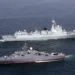 Warships from Iran, Russia, and China sailing together during the Maritime Security Belt 2026 naval exercise in the Strait of Hormuz.