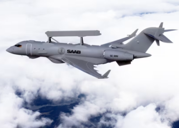 Saab GlobalEye AEW&C aircraft flying above clouds for advanced AI integration project.