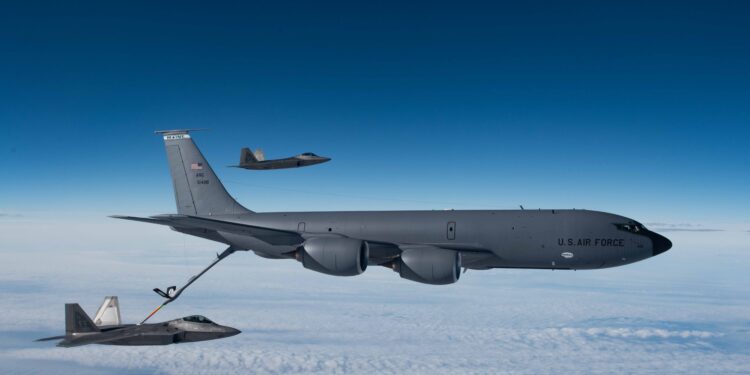 A KC-135 Stratotanker from the 168th Wing refueling an F-22 Raptor over Alaska.
