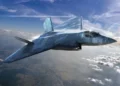 Digital rendering of the GCAP next-generation stealth combat aircraft flying above the clouds.