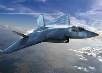 Digital rendering of the GCAP next-generation stealth combat aircraft flying above the clouds.