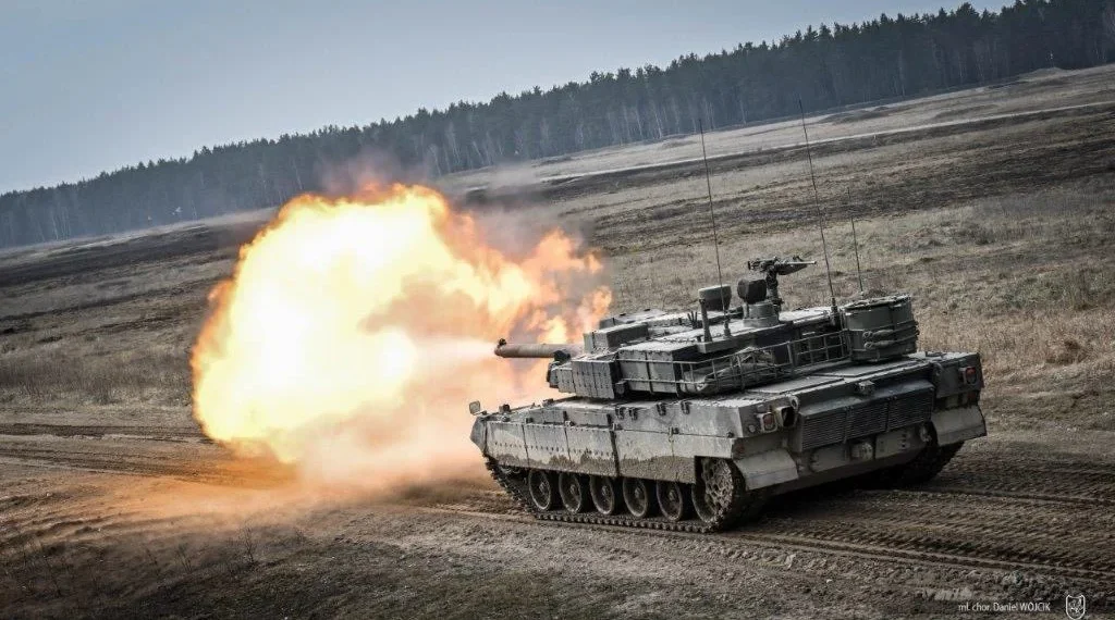 K2PL main battle tank of the Polish Army firing during field exercises.