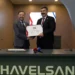 HAVELSAN CEO Mehmet Akif Nacar and TUSAŞ CEO Mehmet Demiroğlu at the signing ceremony for the KOVAN Business Management System during SAHA EXPO 2026.
