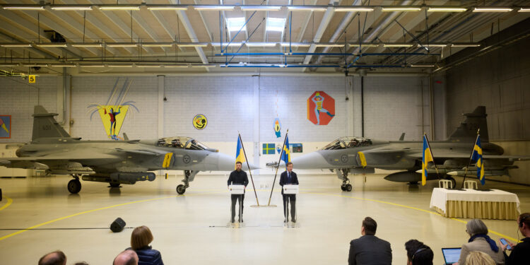 Ukrainian President Volodymyr Zelenskyy and the Swedish Prime Minister during a press conference in front of two Saab Gripen fighter jets