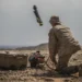 A US Marine launching a Switchblade kamikaze drone, representing the system included in the US FMS approval for Greece.