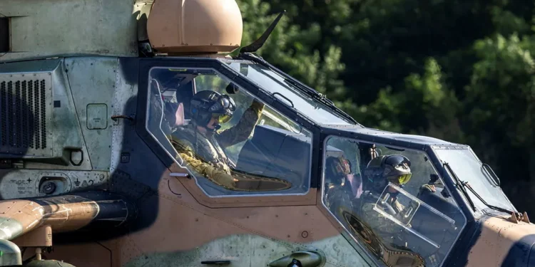 Pilots inside the cockpit of an Australian Army ARH Tiger attack helicopter on duty during the Keris Strike exercise in Malaysia