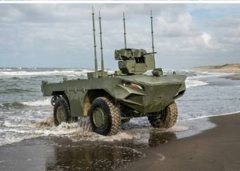 FNSS İ-ZAHA unmanned amphibious vehicle emerging from the sea onto a sandy beach during testing