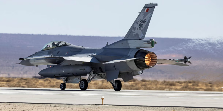 A Bahrain Royal Air Force F-16 fighter jet taking off at Edwards Air Force Base, equipped with the L3Harris Viper Shield electronic warfare system