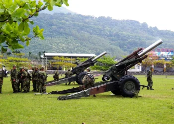 Taiwan Army soldiers pictured with towed howitzers during a military exercise
