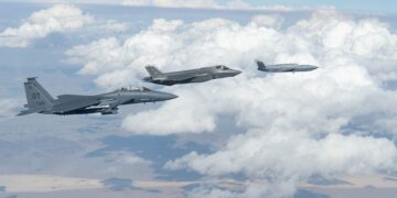 FQ-42 Vengeance flying in formation with F-35 and F-15E